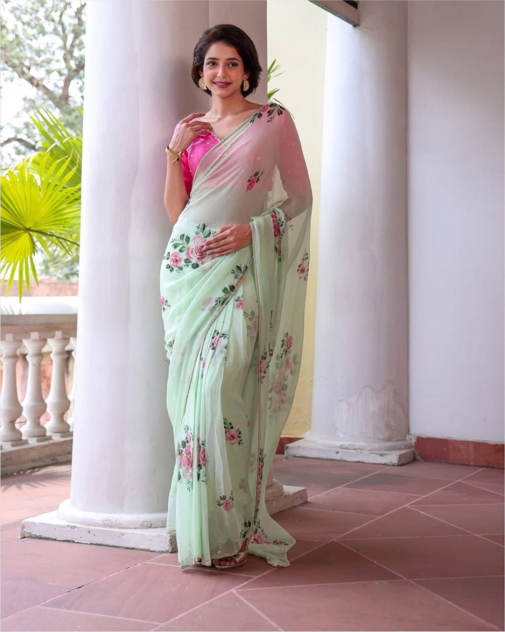 "Pastel Green Floral Saree with Delicate Pink Rose Prints"