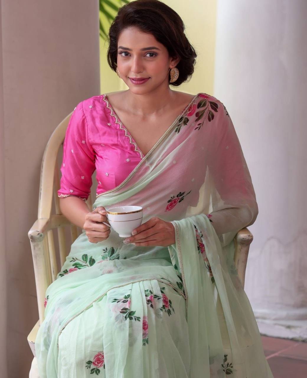 "Pastel Green Floral Saree with Delicate Pink Rose Prints"