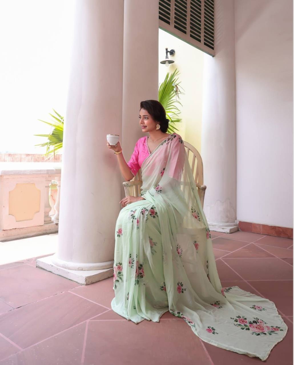 "Pastel Green Floral Saree with Delicate Pink Rose Prints"
